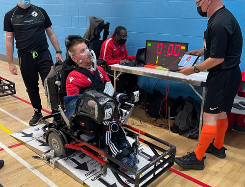 A picture of a powerchair soccer player.