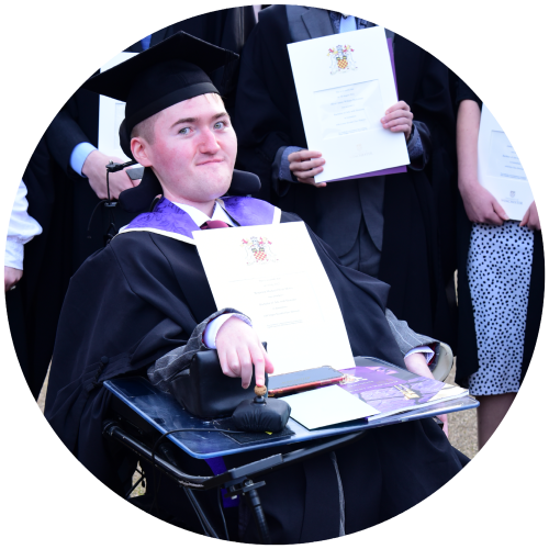 This is a photo of Ben in his wheelchair, graduating from university